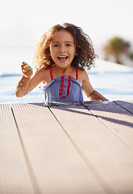 Buy stock photo Child, girl and pool with portrait, costume and blue summer sky for relax and smile. Kid, youth and sunshine with happiness, outdoor and play with curly hair and fun or sunny positivity and childhood