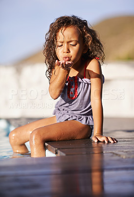 Buy stock photo Shot of a little girl playing by the pool