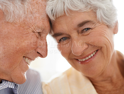 Buy stock photo Couple, senior and forehead touch in portrait, home and relax together for bonding and smile. Elderly people, love and care in marriage or relationship in retirement, closeup and security in house