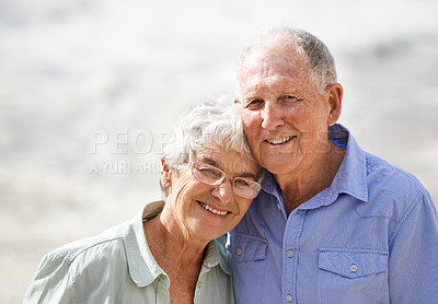 Buy stock photo Elderly, couple and happy portrait at beach for retirement vacation or anniversary to relax with love, care and commitment with support. Senior man, woman and together by ocean for peace on holiday.