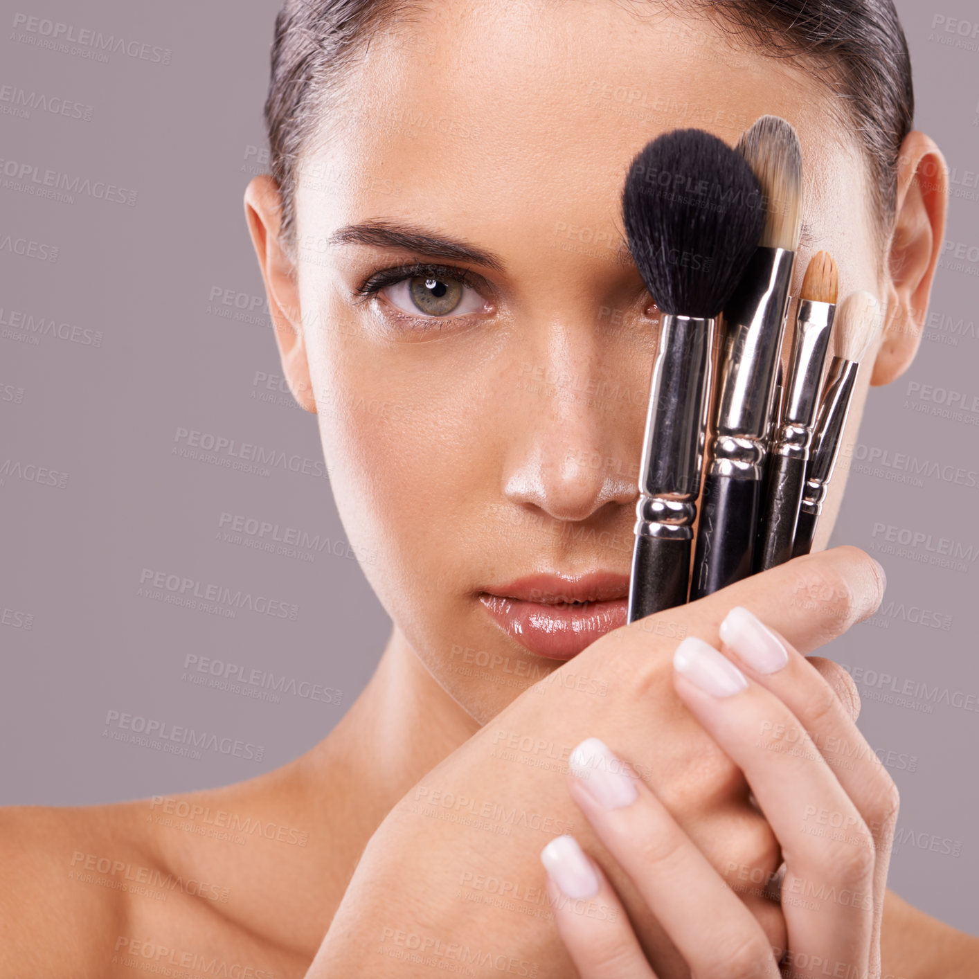 Buy stock photo Woman, beauty and brush with makeup, portrait and studio for glamour and radiance and lip gloss. Female person, blush cosmetics and foundation in grey background, tools and attractive confidence
