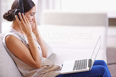 Buy stock photo Woman, laptop and headphones on sofa with smile for online education, music or learning on web in home. Student girl, computer and happy for webinar, development and listen on couch with mockup space