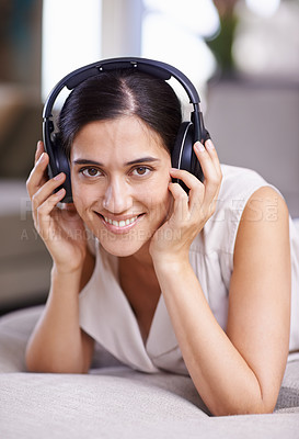 Buy stock photo Happy woman, portrait smile and headphones for music listening, free time or relaxing on sofa at home. Face of female smiling in happiness on living room couch with headset for audio sound track