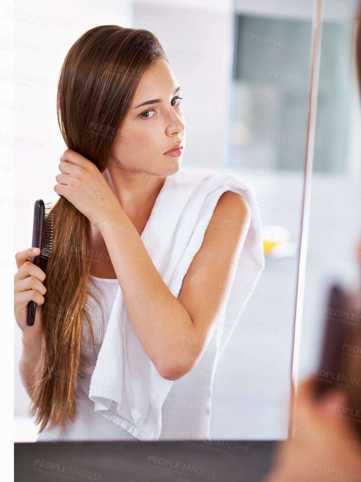Buy stock photo Mirror, woman and brush hair in home bathroom for beauty, care or morning routine with cosmetics. Reflection, hairstyle and serious person combing for cleaning, hygiene and treatment for wellness