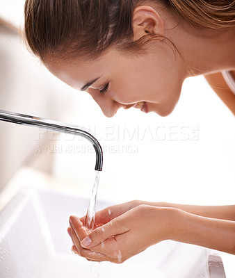 Buy stock photo Woman closeup and water with washing face and hygiene in  sink for self care and beauty with smile in restroom. Female person, cleaning and tap in bathroom, morning and happy for health at home 