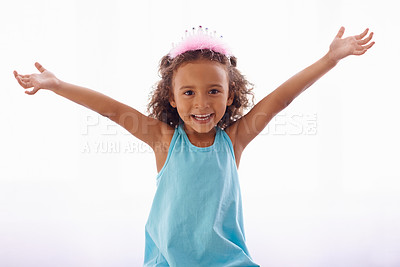 Buy stock photo Little girl, excited and portrait on white background, princess crown and sweet for birthday and cute. Female child, kid and face for curly hair, happiness and joy for costume and playful in studio