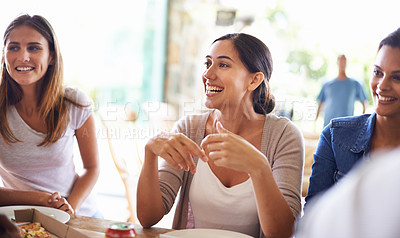 Buy stock photo Cropped shot of a group of friends enjoying pizza together