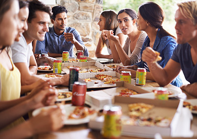 Buy stock photo Friends, group and eating of pizza in house with happiness, soda and social gathering for bonding in backyard. Men, women and fast food with smile, drinks and diversity at table in lounge of home