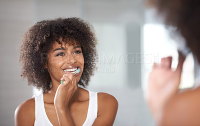 Buy stock photo Reflection, health and black woman brushing teeth, cosmetics and oral health at home. Female person, model and girl cleaning her mouth, mirror and dental hygiene with fresh breath, wellness and care