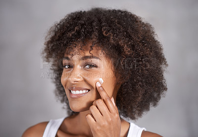 Buy stock photo African woman, portrait and skin cream for beauty, wellness and afro in home bathroom to start morning routine. Girl, person and serum with cosmetics, change and transformation with hair in apartment
