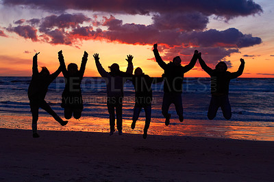 Buy stock photo Beach, sunset and silhouette of jumping friends in nature, freedom and celebrating travel outdoor. Shadow, jump and group of people at the ocean and sunrise for adventure, celebration or sea vacation