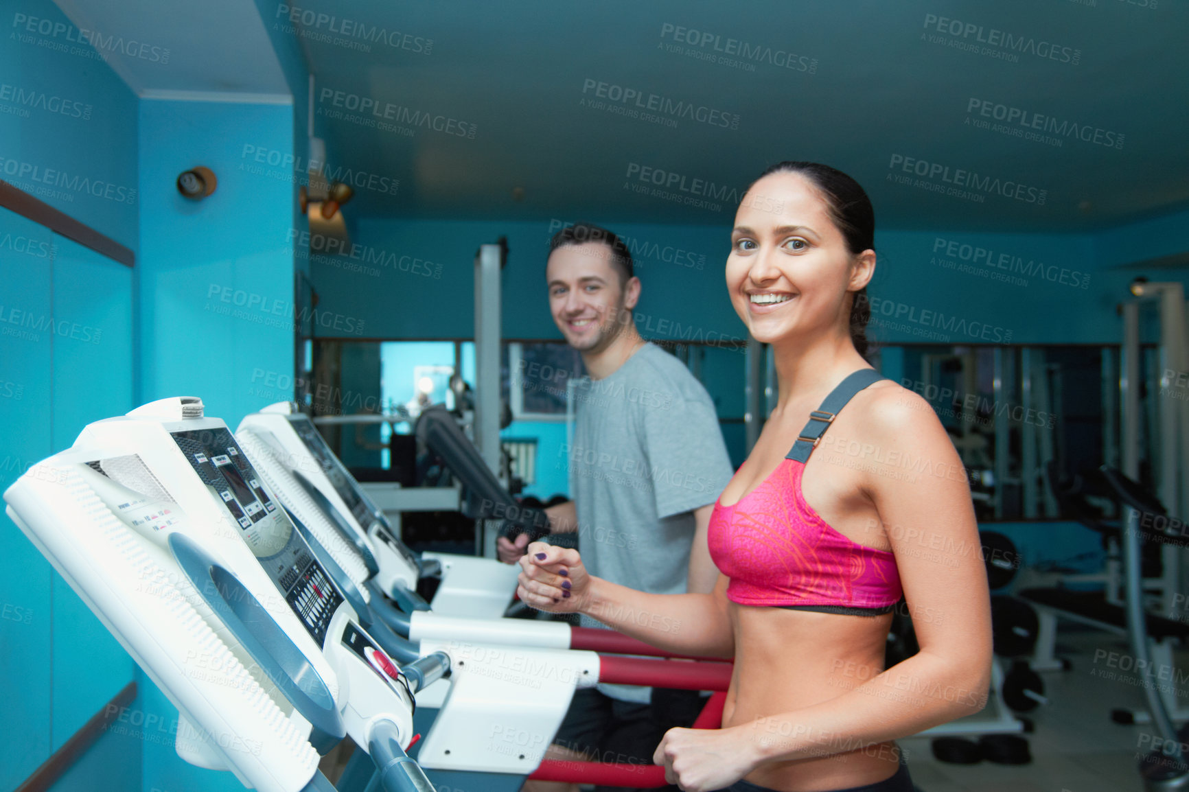 Buy stock photo Shot of an attractive young woman and her trainer in the gym