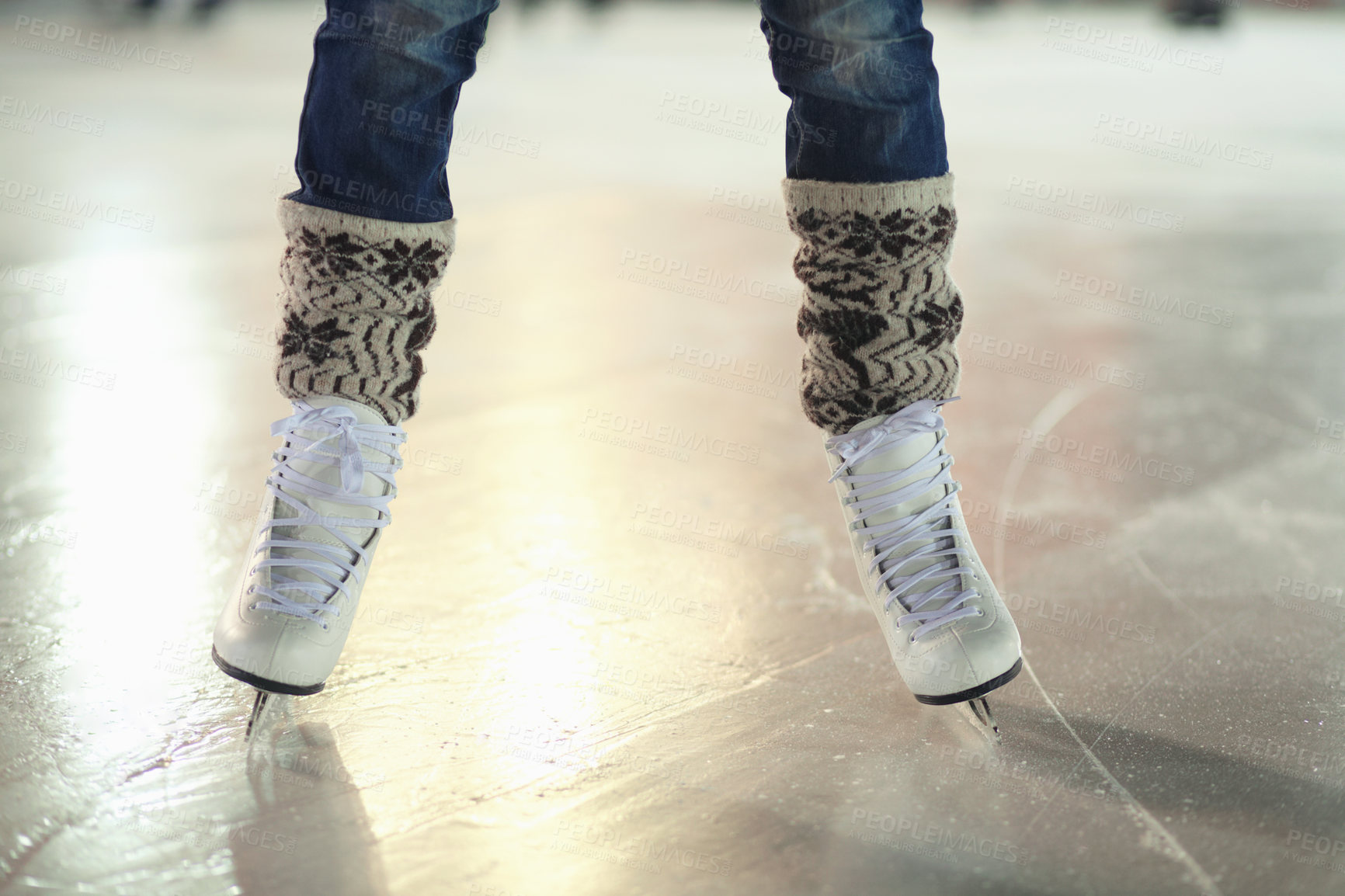 Buy stock photo Ice skates, woman shoes and legs of skater training, recreation and skate on frozen floor, arena or stadium. Winter, entertainment and feet of female person balance, active or learning figure skating