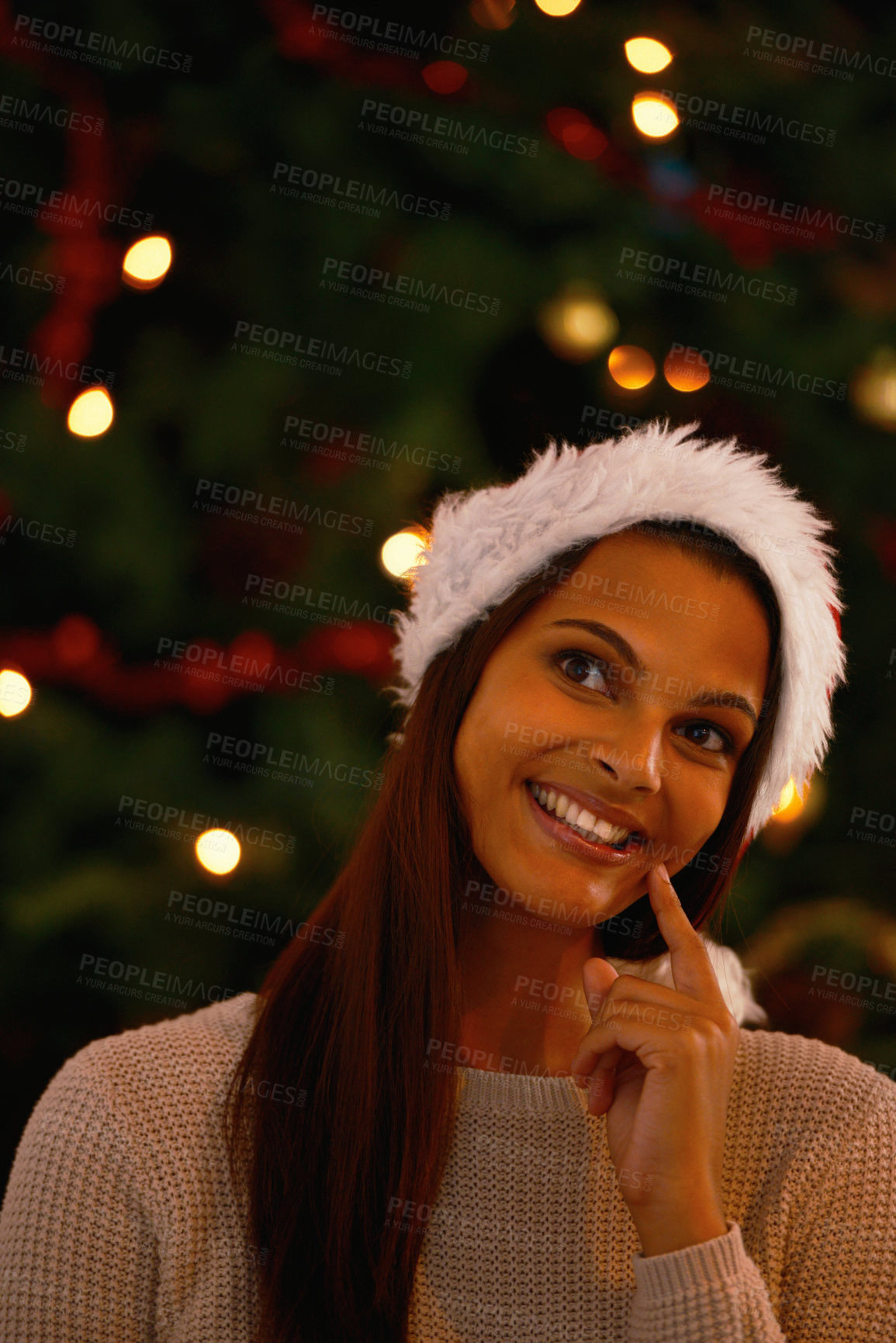 Buy stock photo Happy woman, home and thinking of gifts by christmas tree, love and holiday season in living room. Young person, smile and excited or guess for present with gratitude and care for kindness or giving