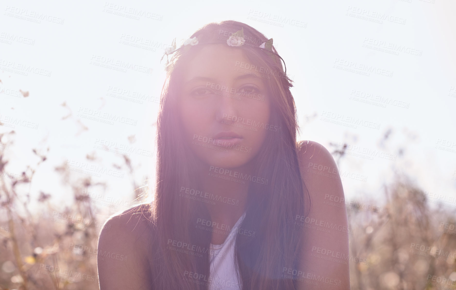 Buy stock photo Woman, portrait and hipster with headband in wheat field or nature for outdoor summer or sunshine. Face of young female person, teenager or brunette in relax for season with lens flare in countryside