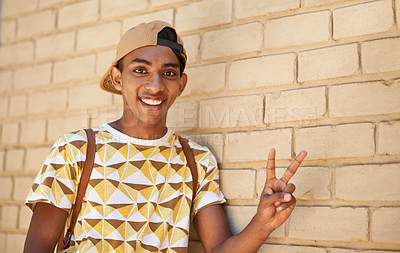 Buy stock photo Portrait, smile and teenage man with peace sign, gesture and happy at school on break. Campus, student and education for gen z male from Middle East, confidence and arab pupil at college of learning