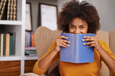 Buy stock photo Portrait, black woman and reading book in lounge to relax for literature, leisure and hobby in house. Happiness, education and face of female student for learning, knowledge and information 