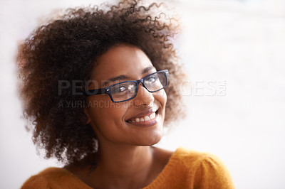 Buy stock photo Woman, portrait and smile with confidence or glasses with positive good mood, cheerful or white background. Female person, student and eyewear for vision with curly hair or relaxed, happiness or calm