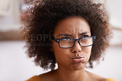 Buy stock photo African woman, pouting and thinking expression on face, confused and doubt in home. Eyewear, planning and problem solving or wondering, frustrated and decision or contemplate on choice or idea