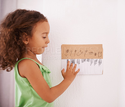 Buy stock photo Shot of an adorable little girl playing with a hand-drawn piano keyboard