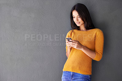 Buy stock photo Phone, app and woman in house with social media, scroll or reading sign up info on wall background. Smartphone, search and female person at home online with google it, competition or giveaway sign up