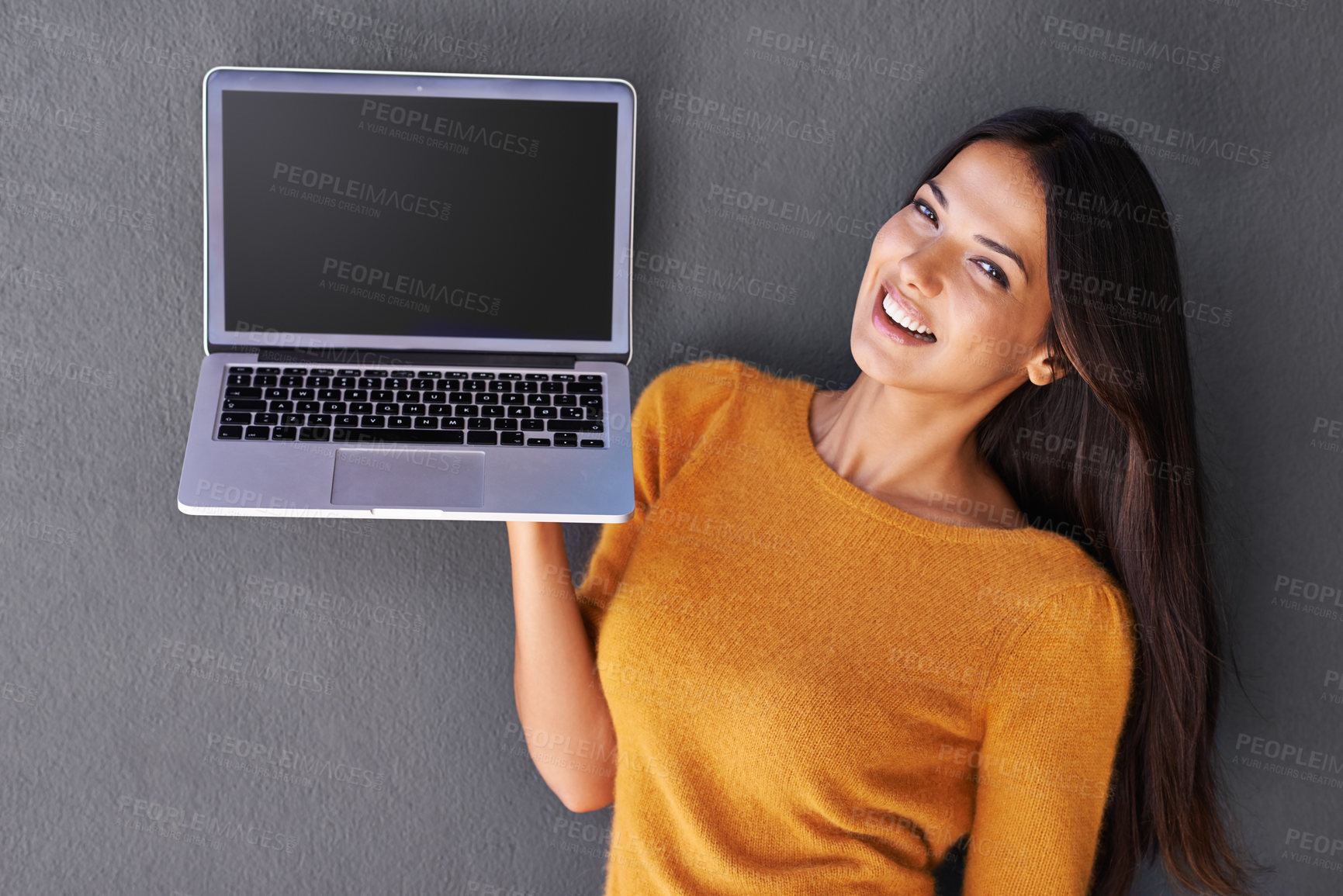 Buy stock photo Woman, portrait and laptop screen in studio, display and mockup space for website or app. Happy female person, online and blank or empty for marketing or advertising, social media and gray background