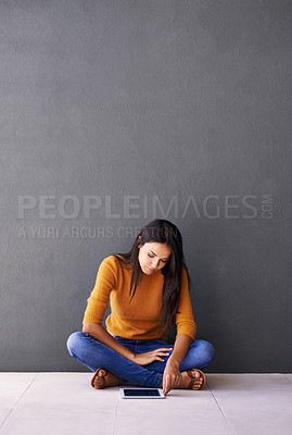 Buy stock photo Tablet, search and woman on a floor with social media, scroll or elearning research on wall background space. Digital, mockup or lady student in a house with app for ebook, course or online education