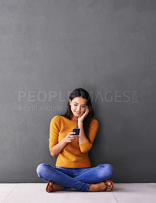 Buy stock photo Woman, phone and internet for communication in home, online and notification on floor. Female person, mockup space and scroll or browse on social media, wall background and app for networking or blog