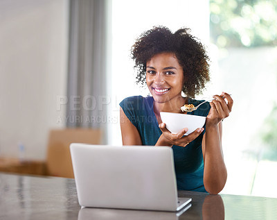 Buy stock photo Portrait, eating cereal and happy woman on laptop in home for remote work with person at desk in apartment. Face, computer and freelancer with food at table, breakfast or healthy diet in South Africa