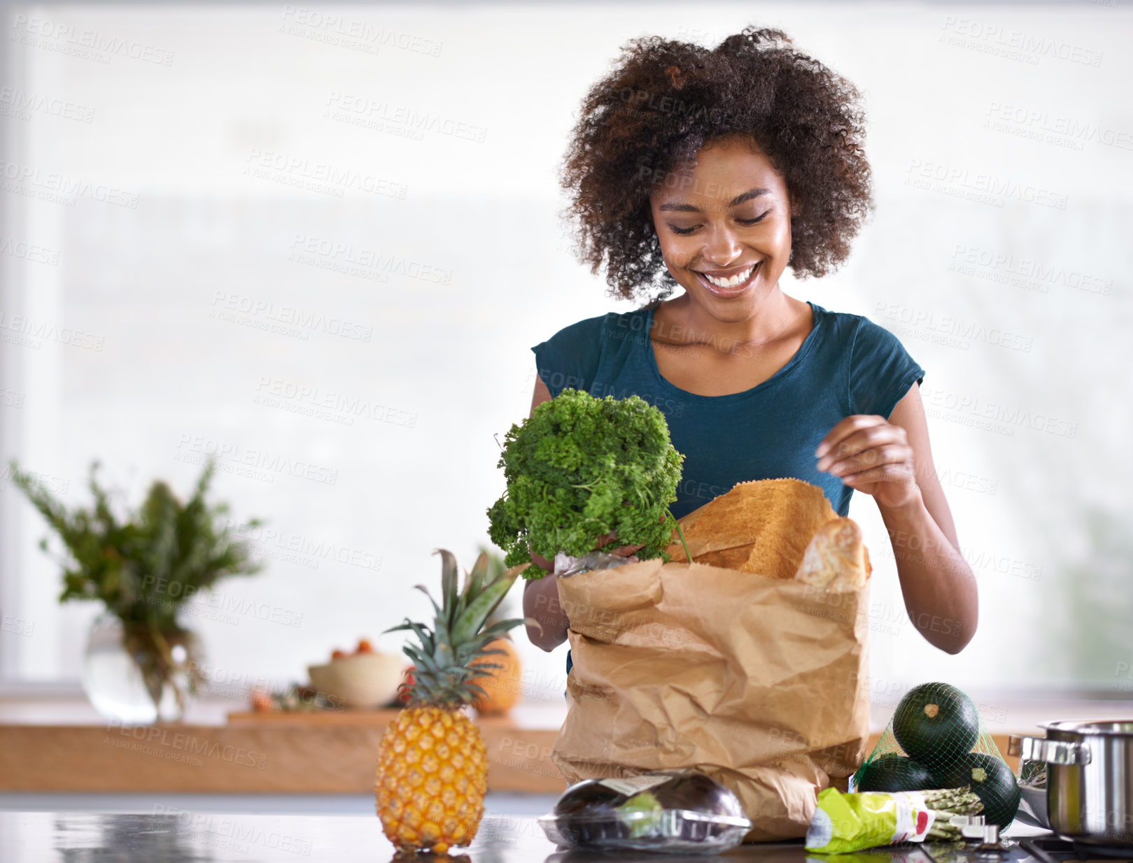 Buy stock photo Cropped shot of a young woman with some groceries
