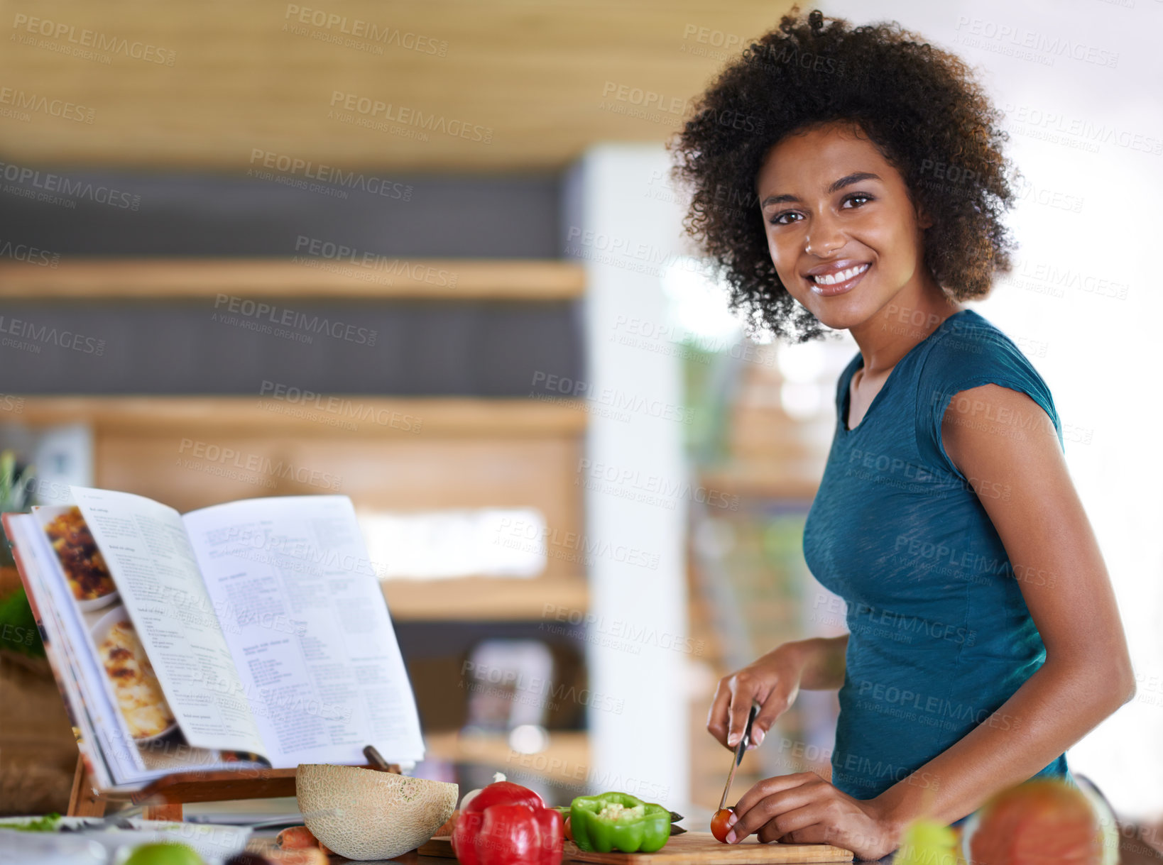 Buy stock photo Cooking, portrait and happy woman cutting vegetables with recipe book in kitchen for healthy diet, nutrition or lunch. Chopping board, food or face of African person preparing organic meal in home