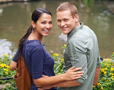 Buy stock photo Couple, hug and date or portrait at park, relationship and care on outdoor adventure or holiday. People, love and embrace on vacation and romance at sanctuary, zoo and calm or peace on weekend trip