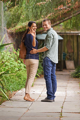 Buy stock photo Couple, waving and love or portrait in garden, relationship and care on outdoor adventure or holiday. People, marriage and walking on vacation and romance in park or zoo, date and calm or peace