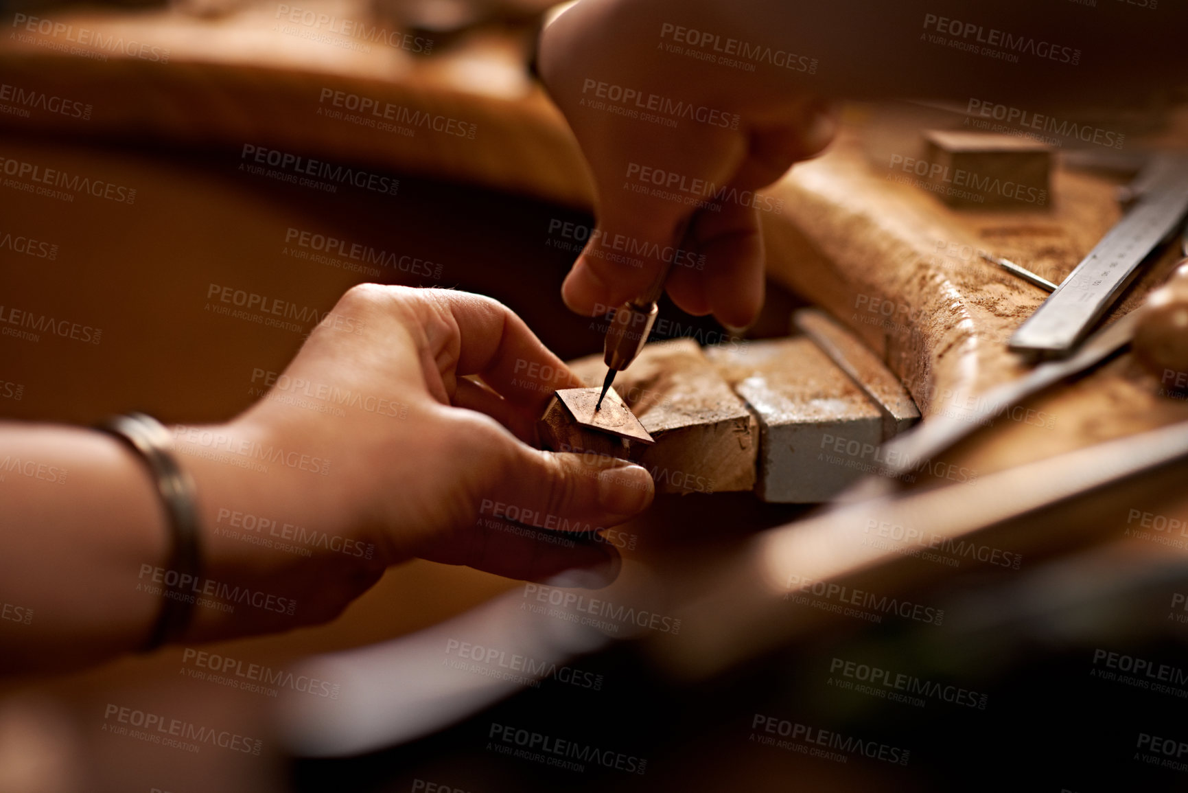 Buy stock photo A person using a tool to work on a piece of wood