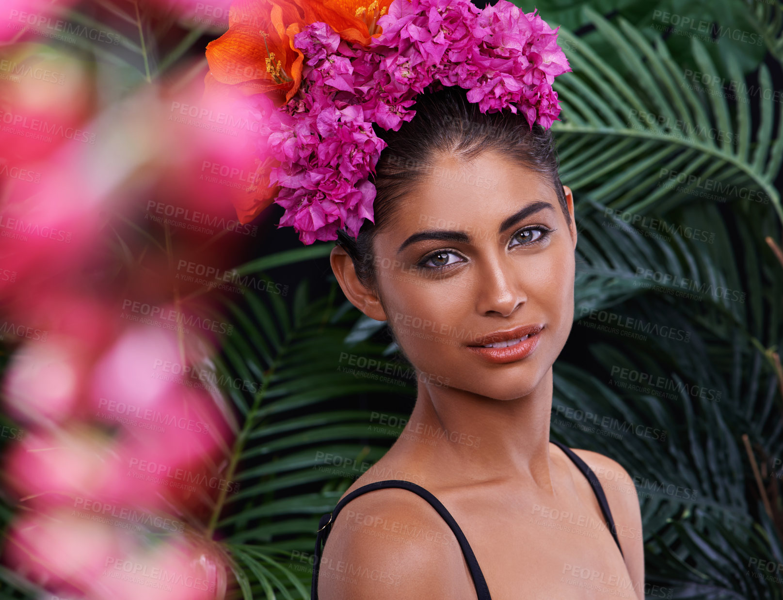 Buy stock photo Jungle, portrait or woman with flowers for natural beauty, cosmetics or wellness in nature aesthetic. Color, Indian person or face of model with at eco friendly skincare, plants or spring floral art 