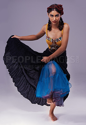 Buy stock photo Portrait, flamenco or woman in dress to dance with energy, freedom or fashion for Spanish style. Creative, purple background or artist in studio, tango or performance in musical culture or tradition