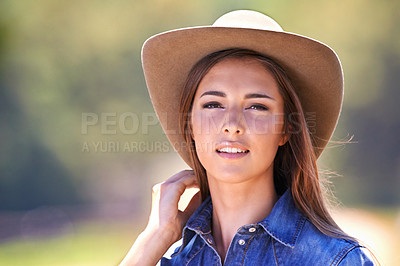 Buy stock photo Cowgirl, portrait and hat at farm, nature and western fashion for agriculture, work and outdoor in summer. Woman, person or farmer at ranch for sustainability, countryside and environment in Texas