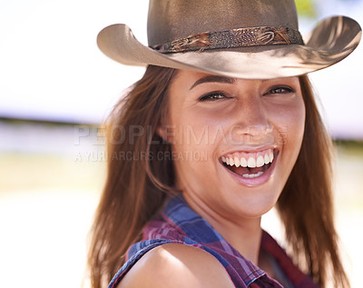 Buy stock photo Portrait, smile and cowgirl laughing on farm or ranch for agriculture or sustainability in summer. Face, smile and funny with happy young person in Texas countryside for organic or green farming