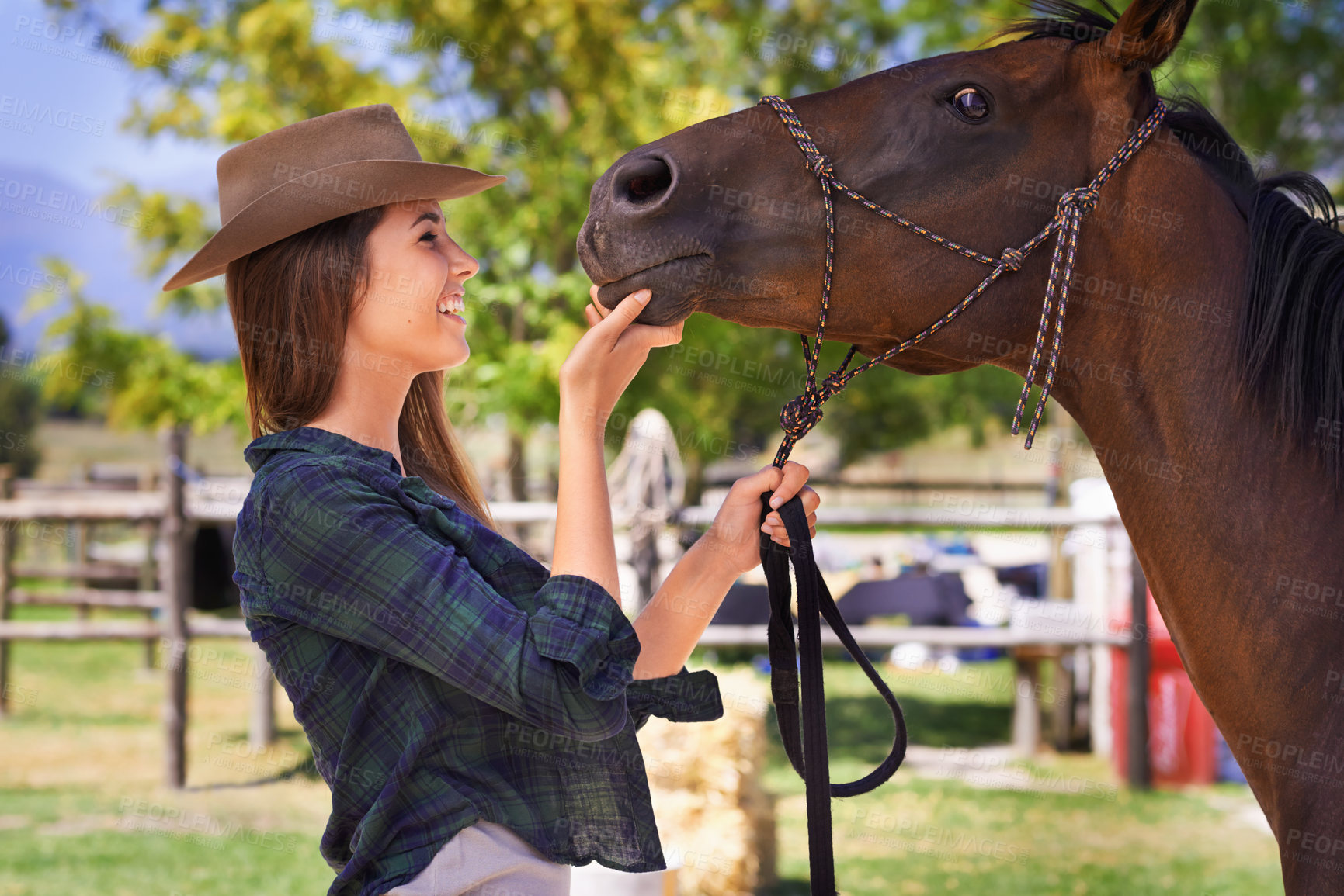 Buy stock photo Cowgirl, smile and woman with horse at farm outdoor in summer or nature in Texas for recreation. Western, happy female person and animal at ranch, pet or stallion in the rural countryside for care