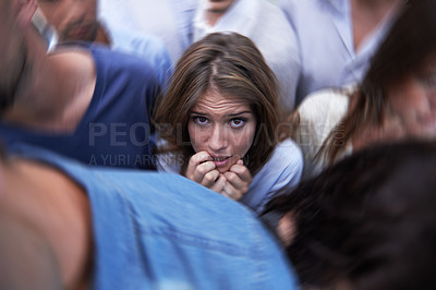 Buy stock photo Woman, crowd and trapped with social anxiety at work with stress, scared and overthinking with concern. Female person, coworkers and people with worry, nervous and stuck at office as introvert