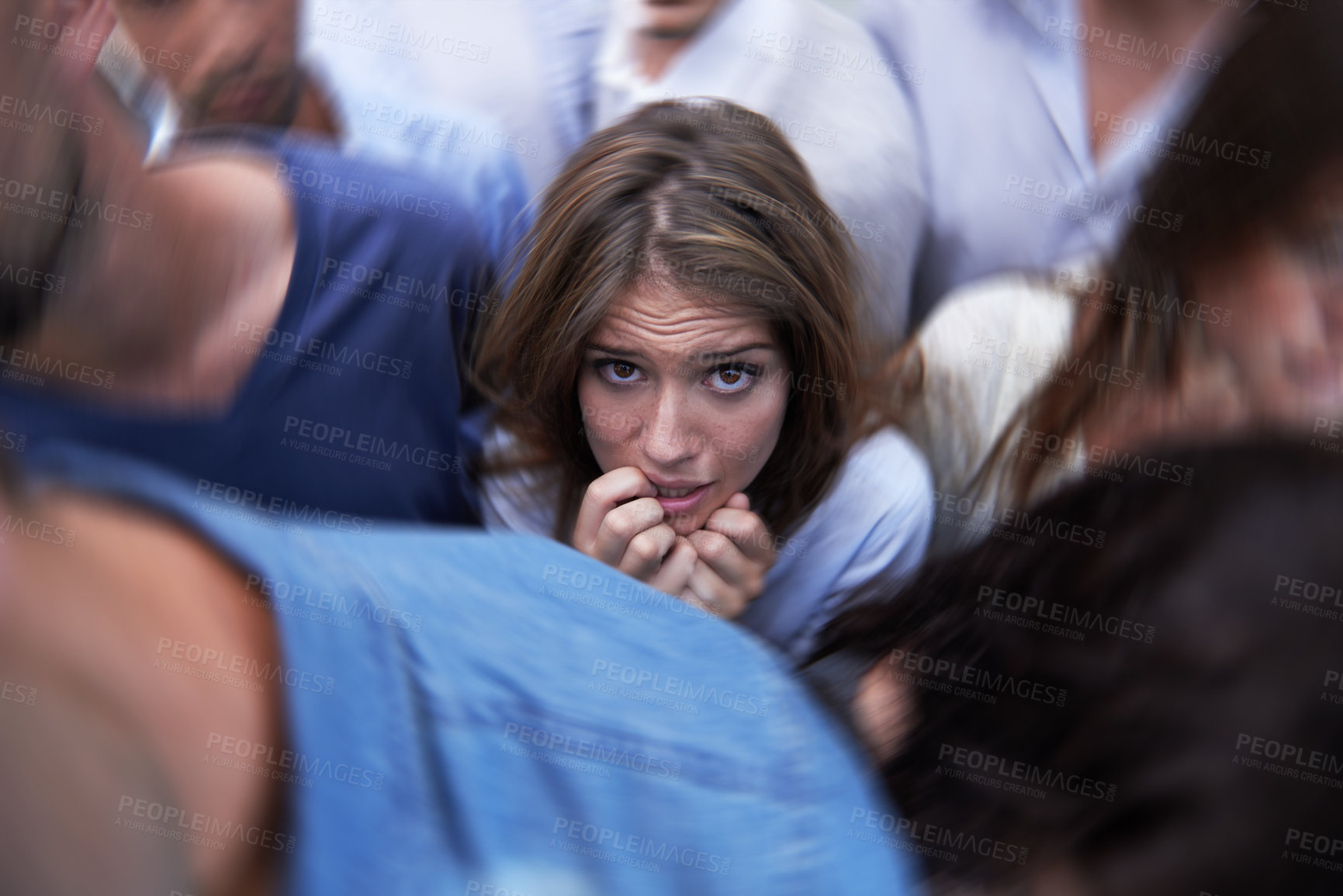 Buy stock photo Woman, crowd and trapped with social anxiety at work with stress, scared and overthinking with concern. Female person, coworkers and people with worry, nervous and stuck at office as introvert