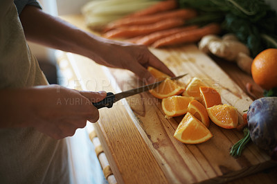 Buy stock photo Closeup, kitchen and fruits with hands, orange or wood board with knife, vegetables or salad. Person, vegan or chef with utensils or ingredients for lunch or supper with healthy meal, home or dinner