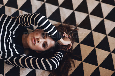 Buy stock photo Portrait, woman or lying on carpet in fashion, couture and clothing for minimalist style aesthetic. Edgy, female person and trendy as texture, pattern and design of contemporary fabric and textile