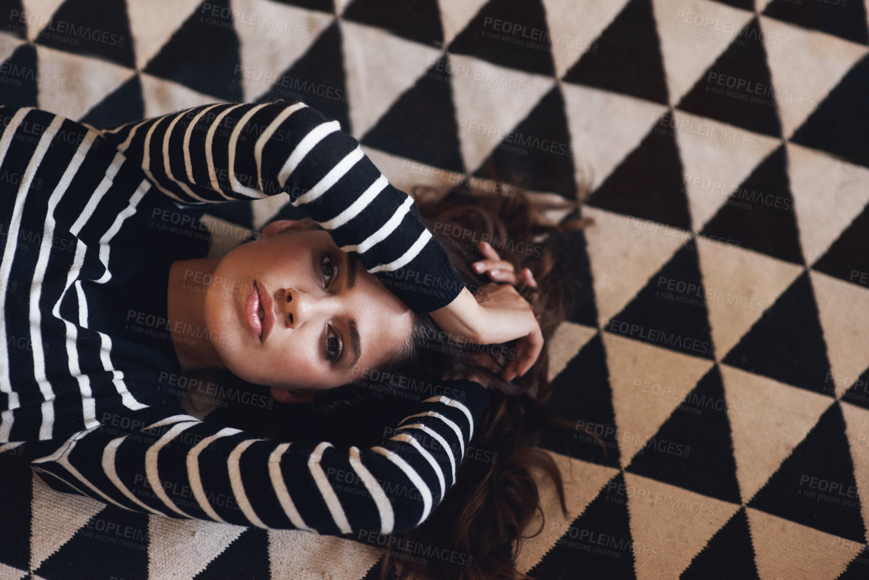 Buy stock photo Portrait, woman or lying on carpet in fashion, couture and clothing for minimalist style aesthetic. Edgy, female person and trendy as texture, pattern and design of contemporary fabric and textile