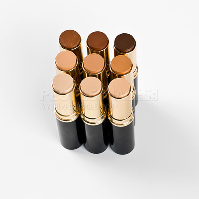Buy stock photo Shot of several lipsticks arranged by shade
