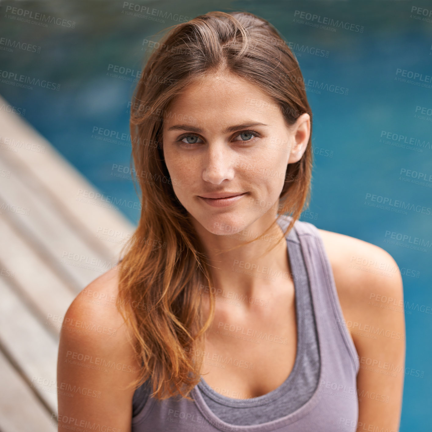 Buy stock photo Portrait, woman and swimming pool for holiday, vacation and outdoor with wellness and fitness. Face of a young person relaxing by water for summer, exercise or workout by a hotel or luxury home 
