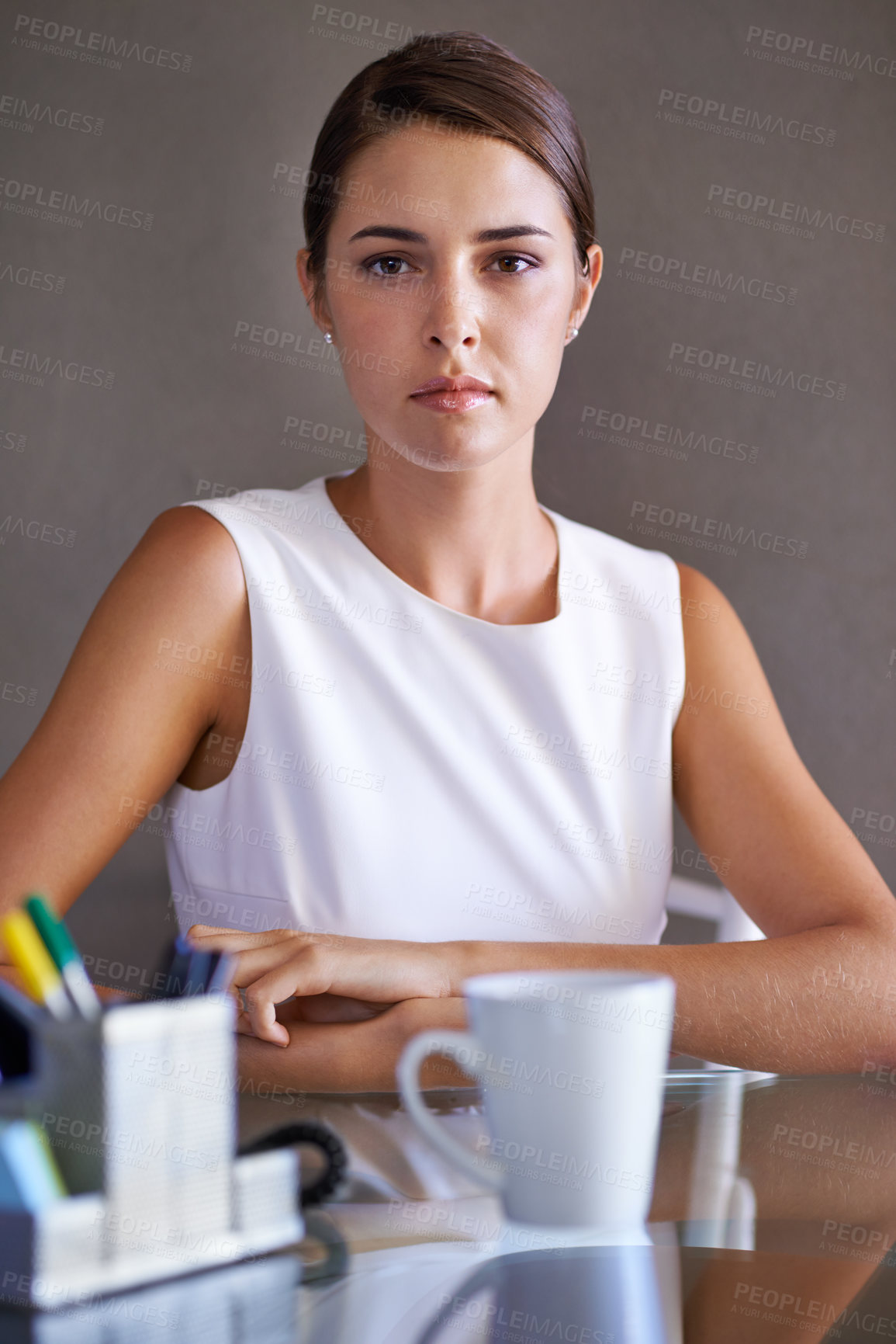 Buy stock photo Portrait, business woman and confident at office desk, arms crossed and ambition in corporate career. Young hr administrator, face and relax in workplace by coffee, stationery and commitment in job