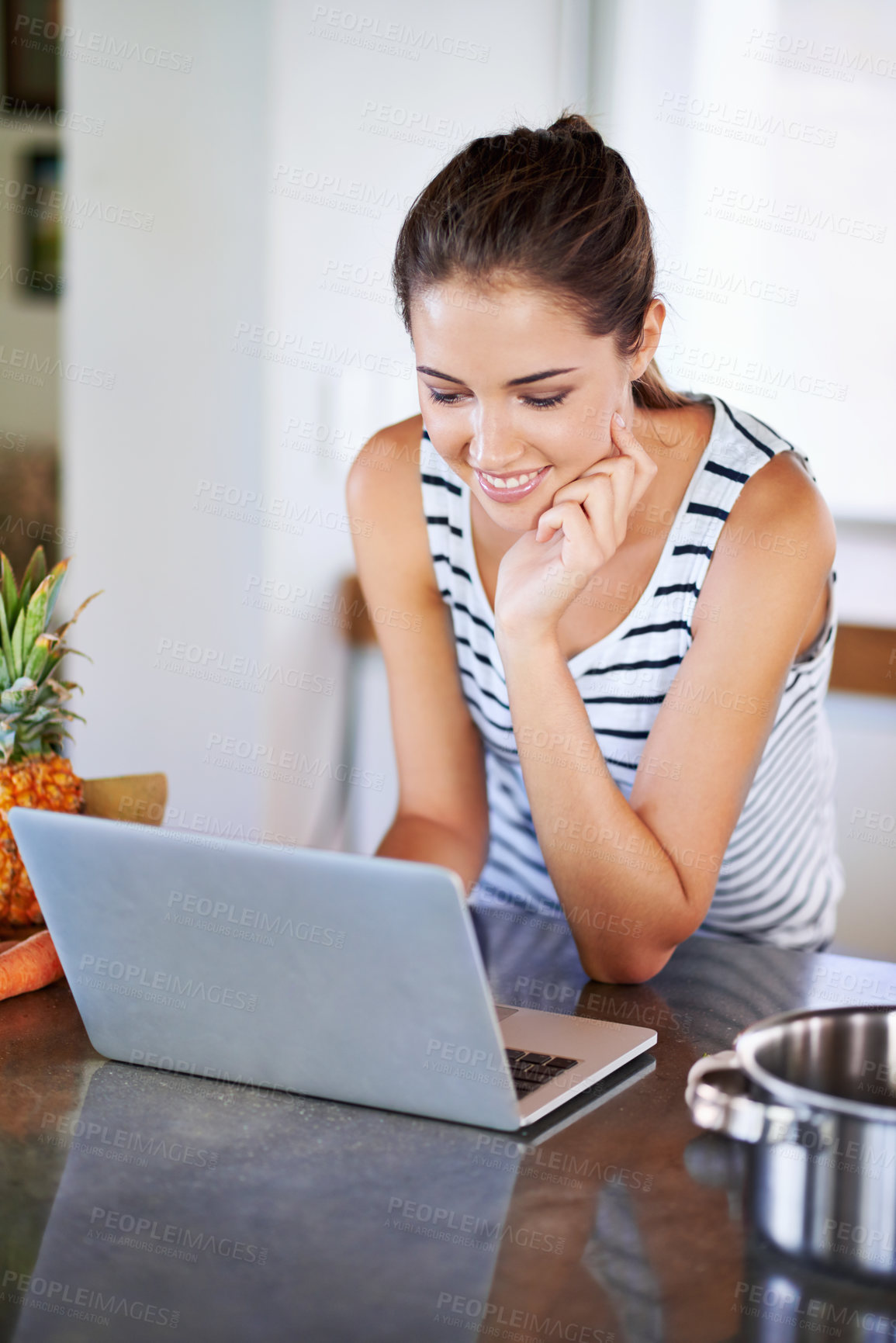 Buy stock photo Woman, working and laptop on kitchen counter, happy female person and home on internet. Google it, browsing cooking recipes and social media, online search on technology for healthy food ideas