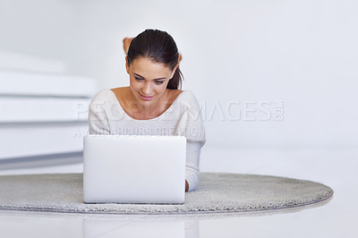Buy stock photo Laptop, floor and happy woman in home for remote work, social media or reading email on internet. Computer, freelancer and person on carpet with technology for networking, blog and relax on mockup