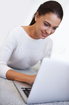 Buy stock photo Laptop, floor and happy woman in home for remote work, social media or reading email on internet. Computer, freelancer and person on carpet with technology for networking, typing or relax in house